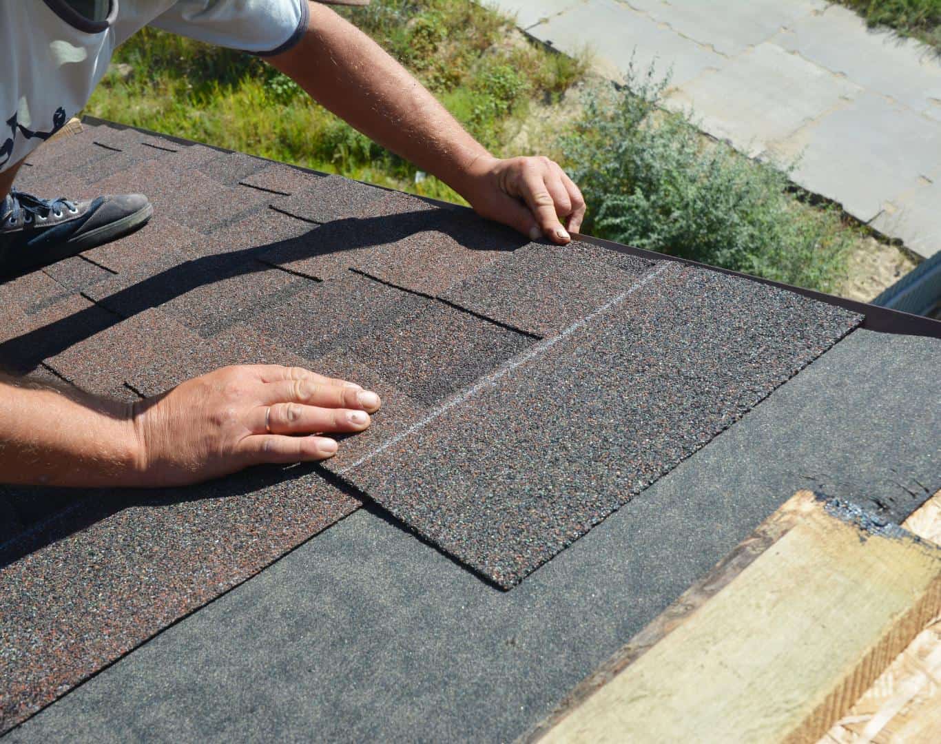 Installing asphalt shingles on a residential roof in Monument, Colorado.