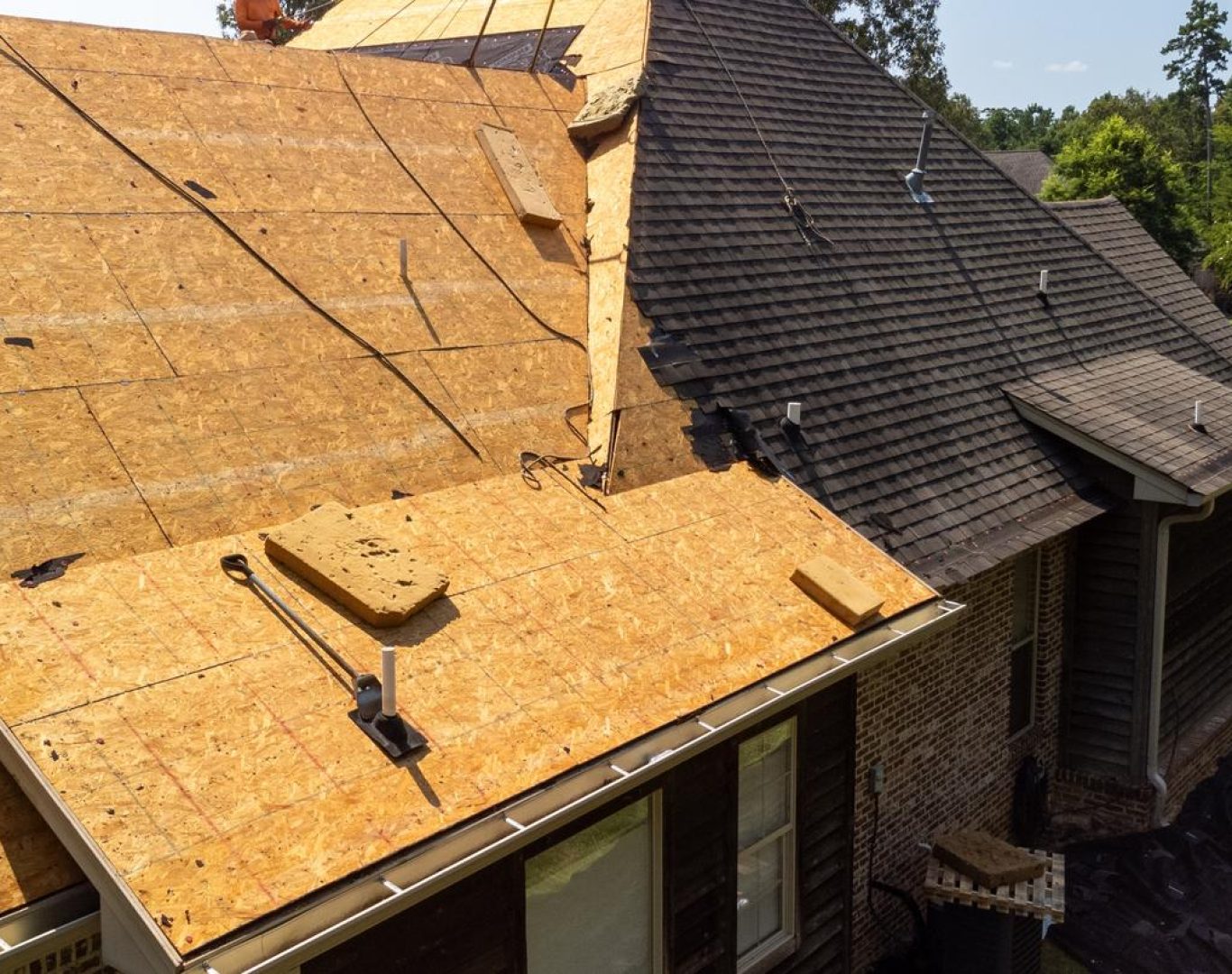 Local roofing company near me in Broomfield, CO conducting flat roof installation