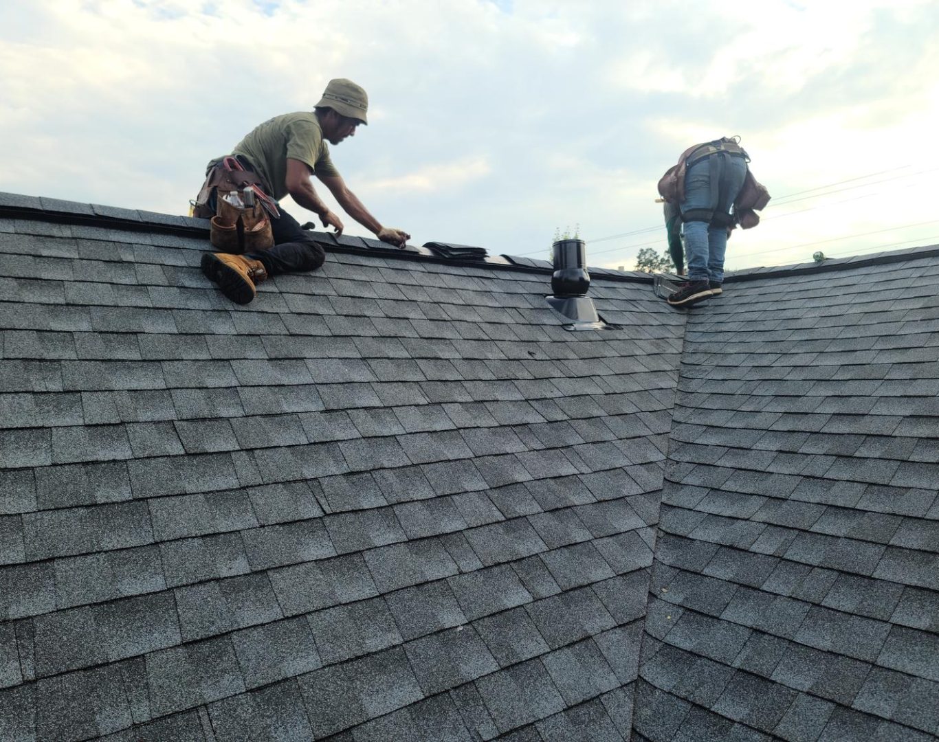 Roofing company in Lone Tree, CO installing a new roof on a luxury home