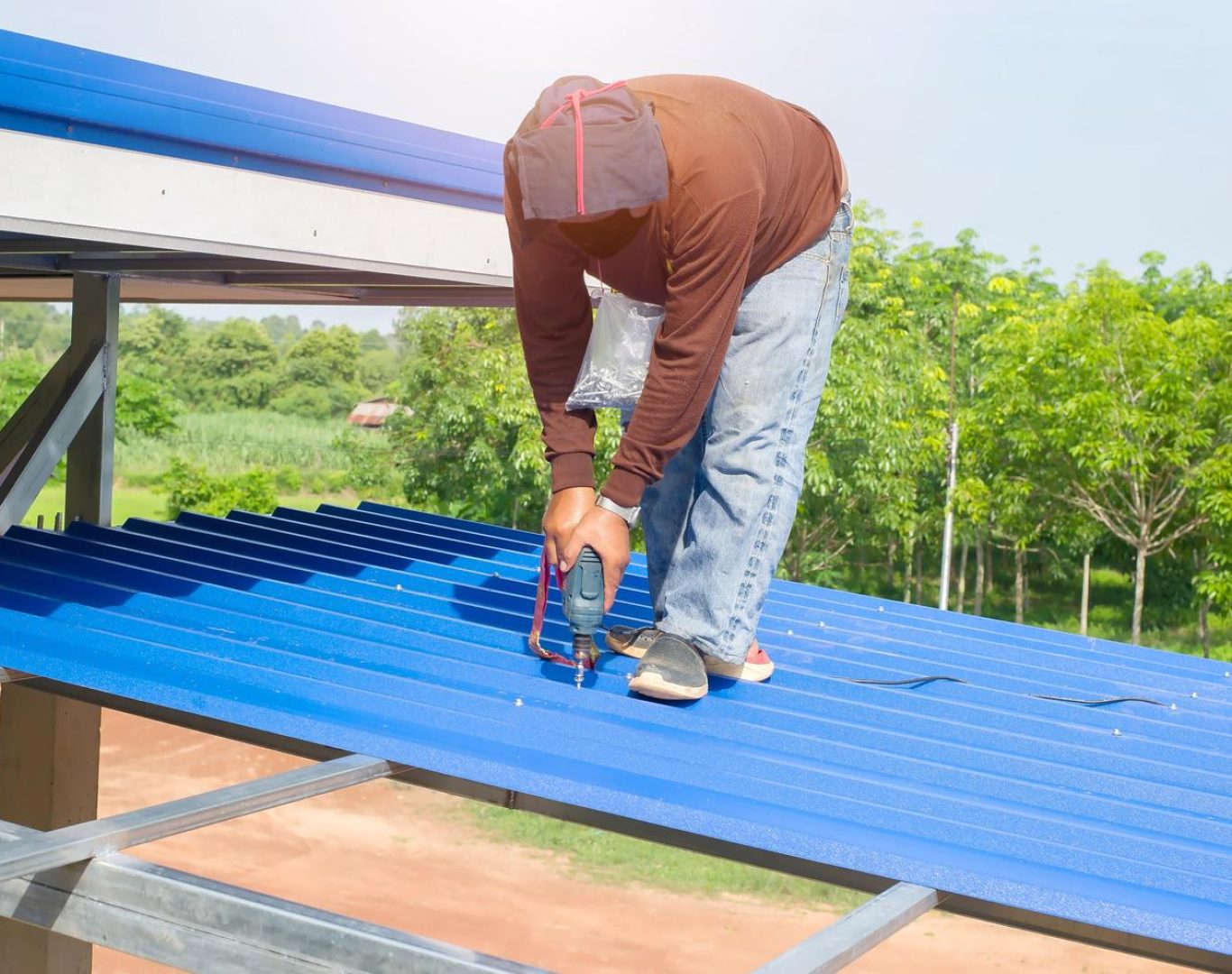 Roofing company in Westminster, CO installing new shingles on suburban home