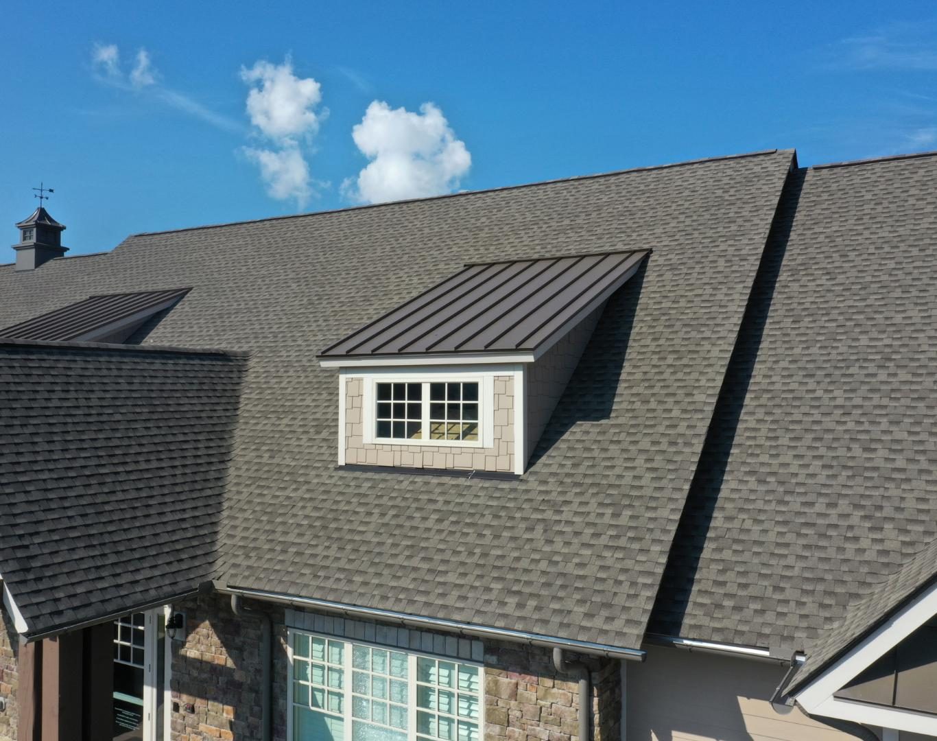 Trusted roofing company near me in Broomfield County, CO completing roof evaluation